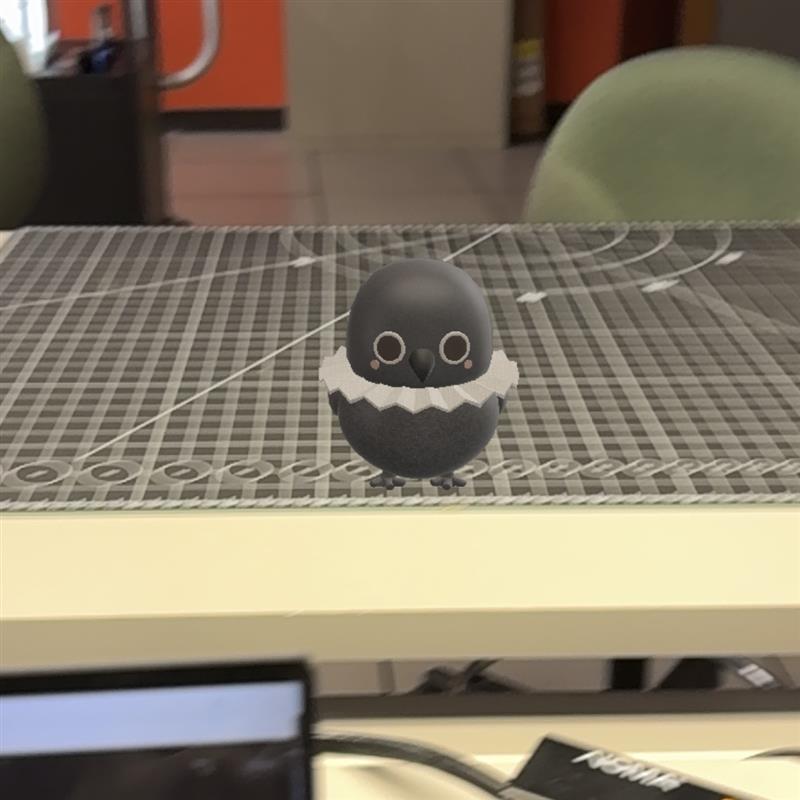 Putting the little crow on a plane to make it looks like standing on the table