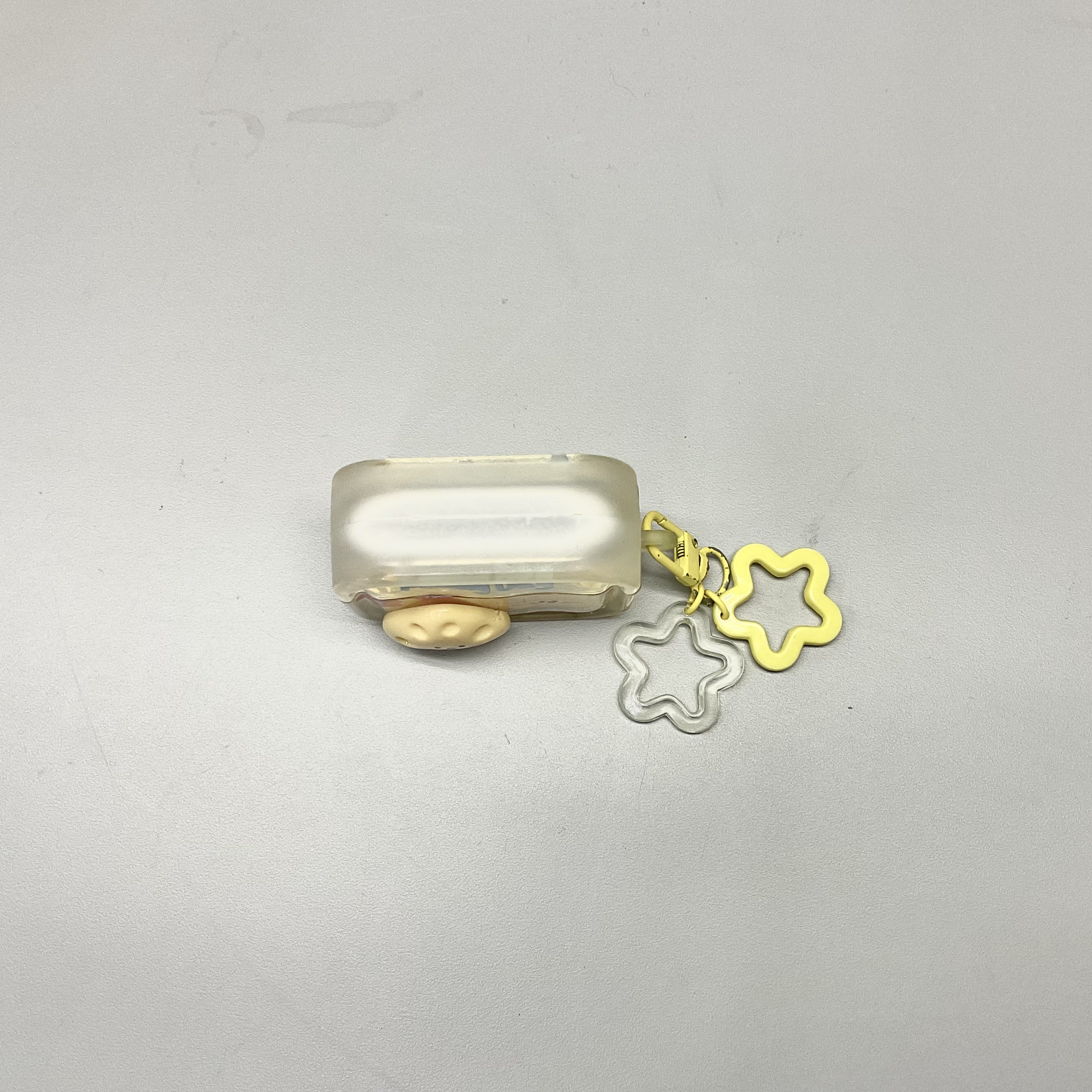 top view of a yellow earbuds case